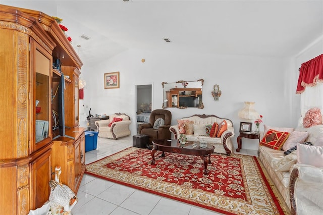 tiled living room featuring lofted ceiling