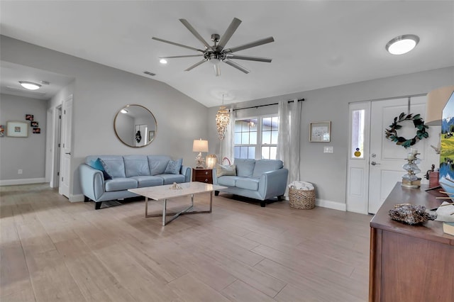 living room featuring light wood-type flooring, vaulted ceiling, and ceiling fan