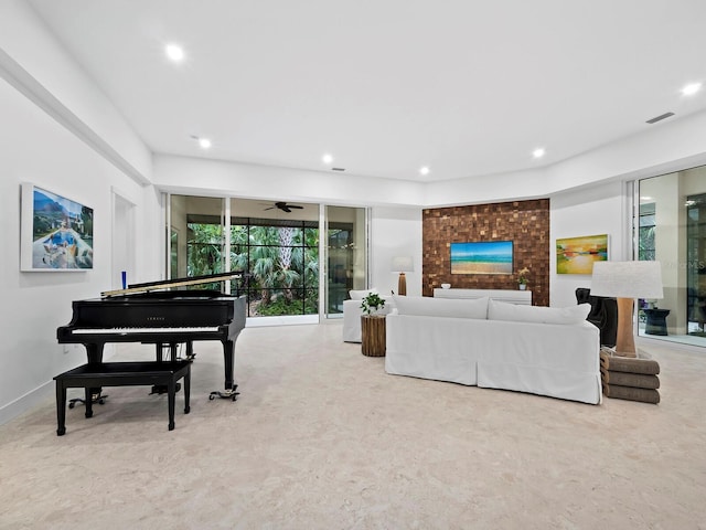 living room with light colored carpet and ceiling fan