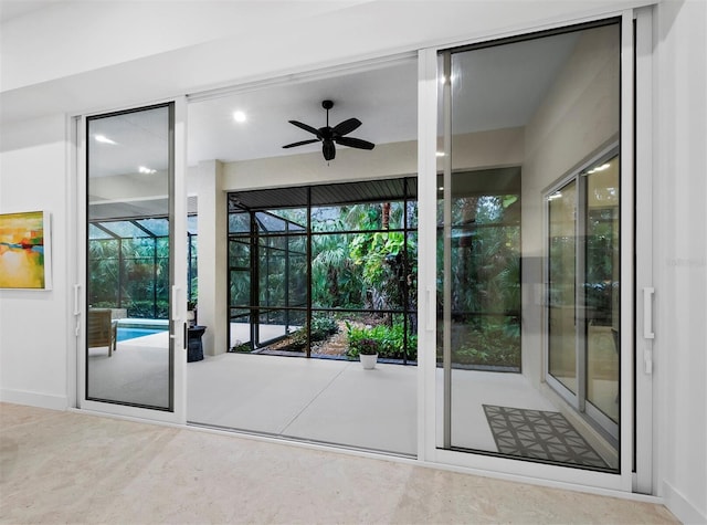 entryway featuring ceiling fan and a wealth of natural light