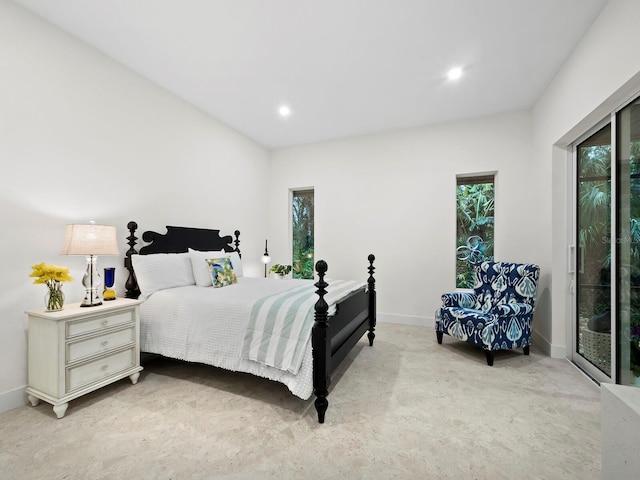 bedroom featuring light colored carpet and access to exterior