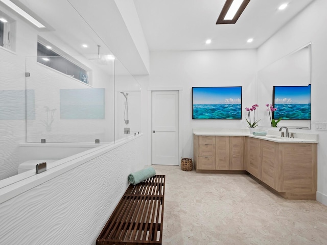 bathroom with vanity and walk in shower