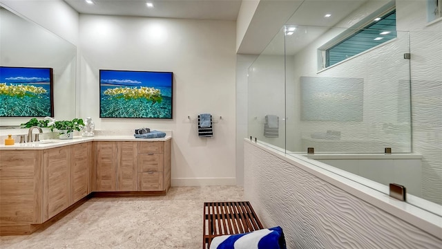 full bathroom featuring double vanity, a sink, recessed lighting, and a walk in shower