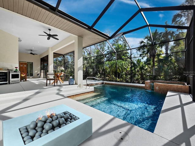 pool featuring ceiling fan, a lanai, and a patio