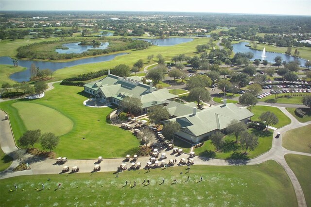 bird's eye view with golf course view, a residential view, and a water view