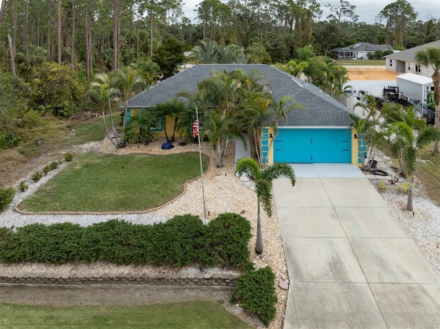 view of front facade with a garage and a front yard