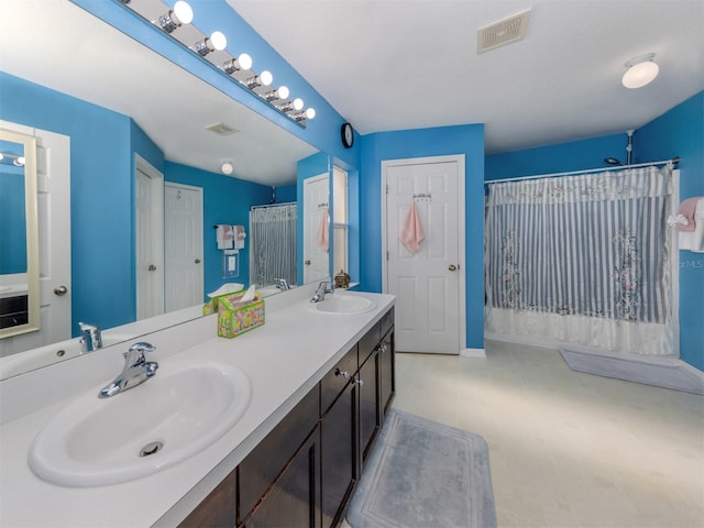 bathroom featuring vanity and a shower with shower curtain