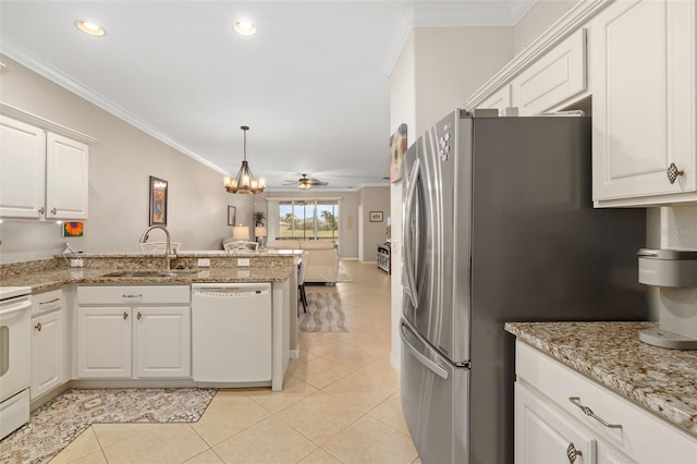 kitchen with ceiling fan with notable chandelier, white cabinets, hanging light fixtures, light tile patterned floors, and white dishwasher