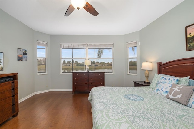 bedroom with dark wood-type flooring and ceiling fan