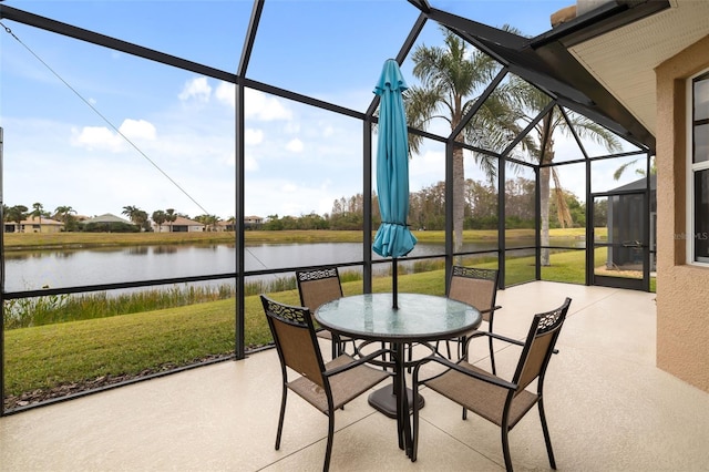 sunroom / solarium with a water view