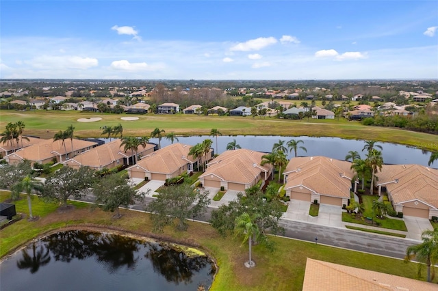 bird's eye view featuring a water view and a residential view