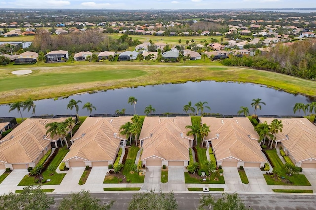 birds eye view of property featuring a residential view and a water view