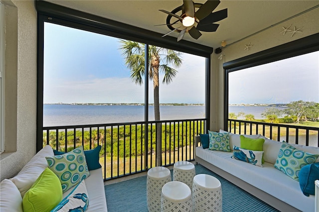 exterior space featuring a water view and ceiling fan