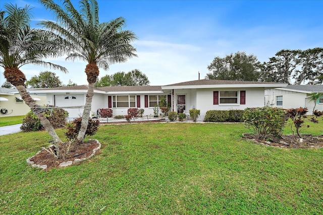 ranch-style home featuring a front yard and a garage