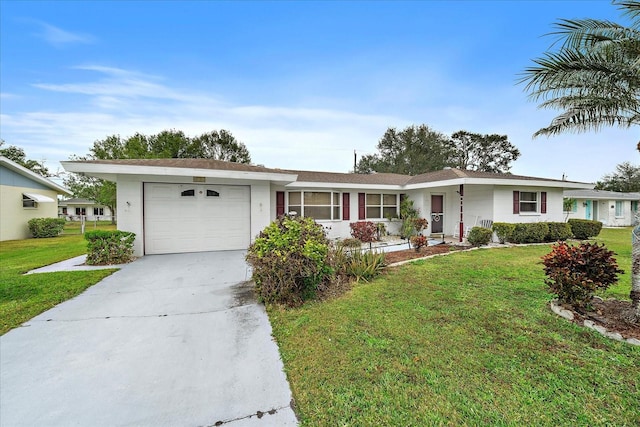 ranch-style house featuring a garage and a front lawn