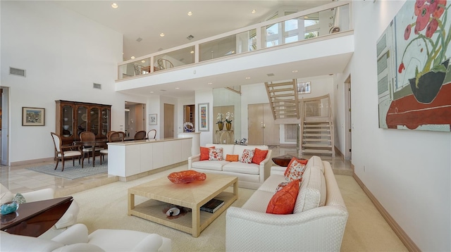 living room featuring a high ceiling