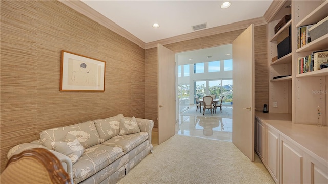 living room featuring light carpet and ornamental molding