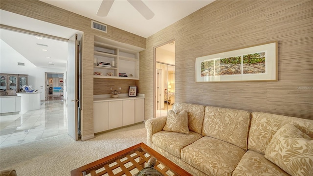 living room with light carpet and ceiling fan