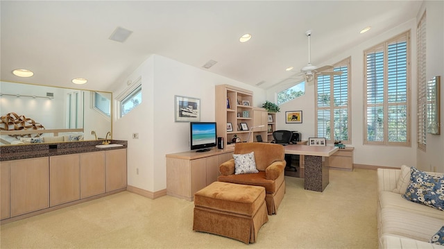 office area with ceiling fan, sink, and vaulted ceiling