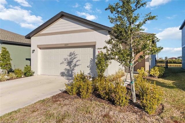 ranch-style home with a front yard and a garage