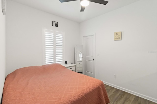 bedroom featuring ceiling fan and dark hardwood / wood-style floors