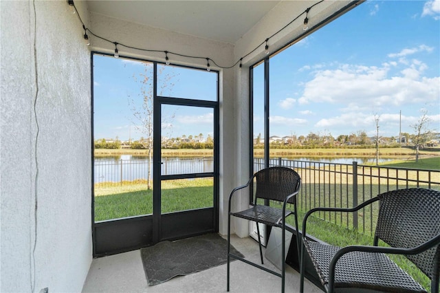 sunroom with a water view