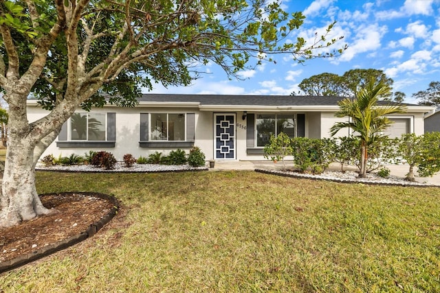 ranch-style house featuring a front lawn