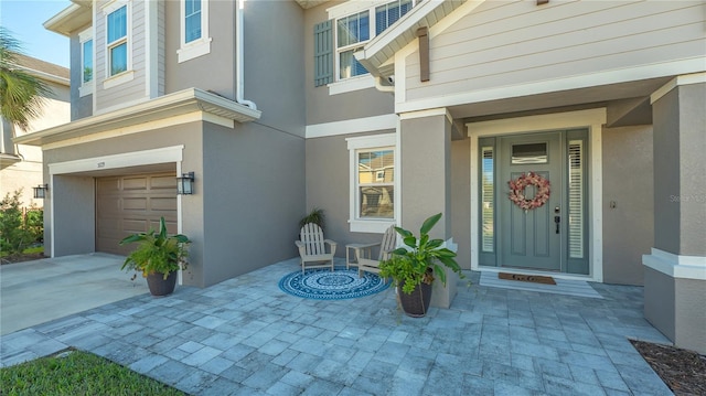 doorway to property with a garage