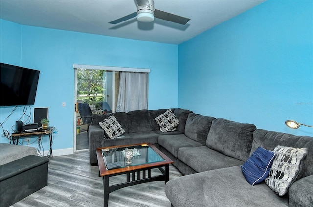 living room with ceiling fan and wood-type flooring