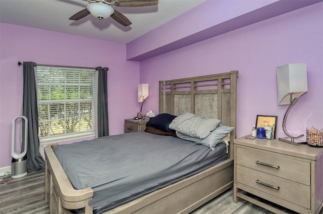 bedroom with ceiling fan and light wood-type flooring