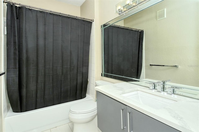 full bathroom with tile patterned flooring, vanity, toilet, and shower / bath combo