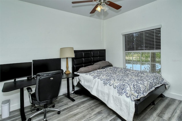 bedroom featuring hardwood / wood-style floors and ceiling fan