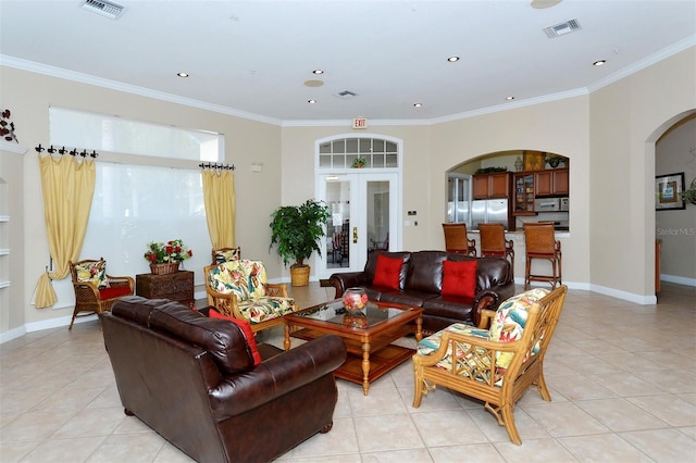 living room with french doors, light tile patterned floors, and crown molding