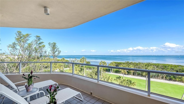 balcony featuring a water view