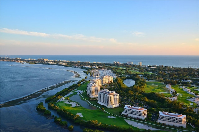 aerial view at dusk with a water view