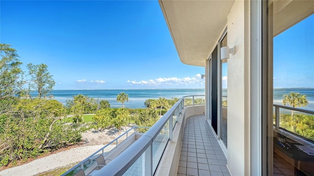 balcony featuring a water view