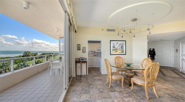 dining room with a water view