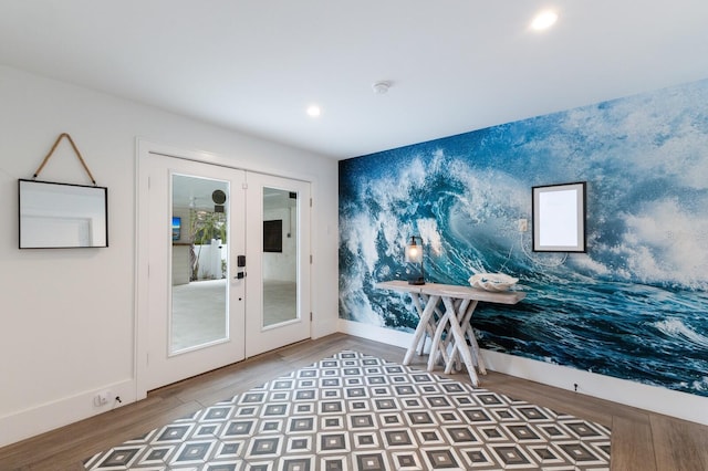 interior space with french doors and hardwood / wood-style flooring