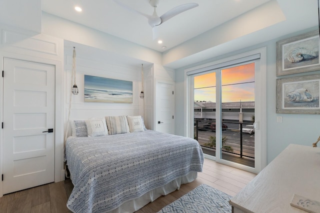 bedroom featuring access to outside, ceiling fan, and hardwood / wood-style floors