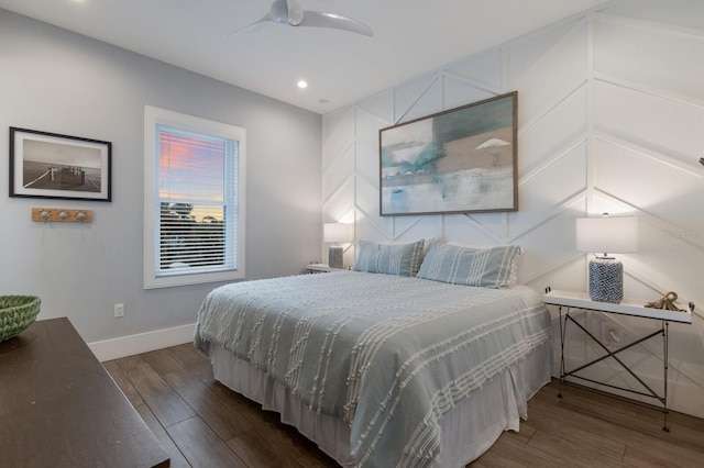 bedroom featuring ceiling fan and dark hardwood / wood-style floors