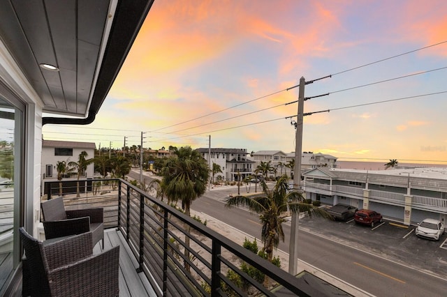 view of balcony at dusk