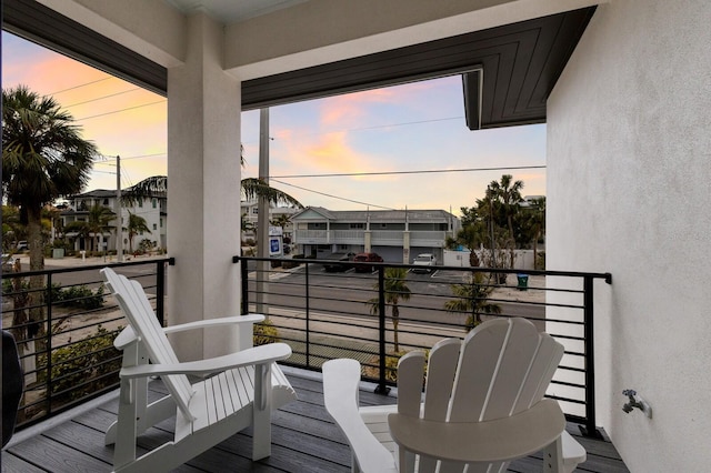 view of balcony at dusk