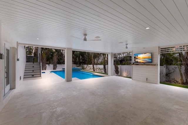 view of pool with ceiling fan and a patio area