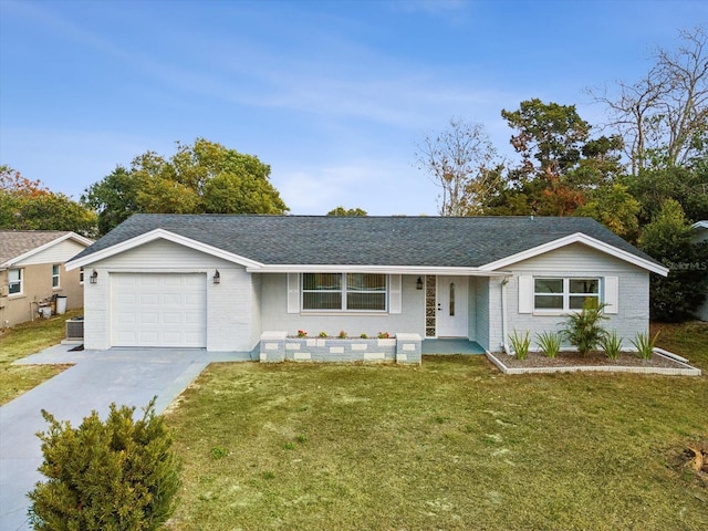 ranch-style home with a garage and a front lawn