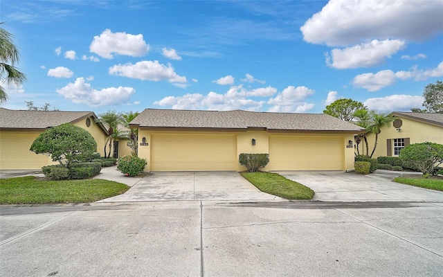 single story home featuring a garage