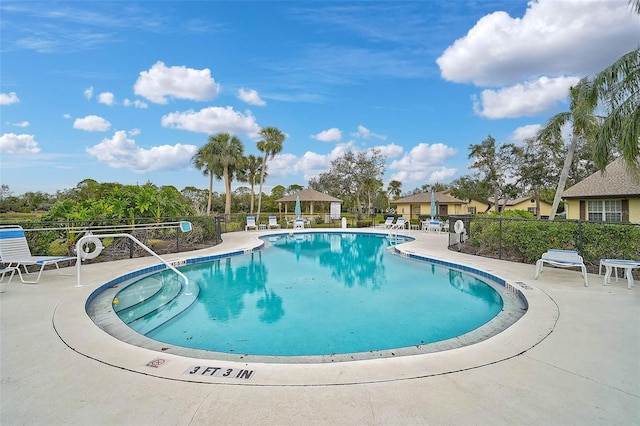 view of swimming pool featuring a patio area