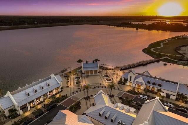 aerial view at dusk with a water view