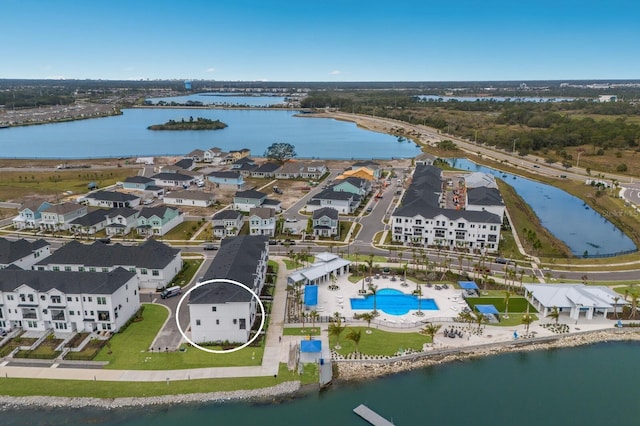 birds eye view of property with a water view