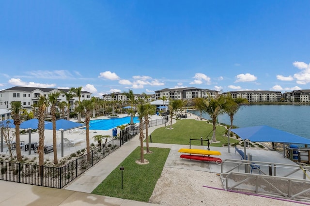 exterior space featuring a water view and a yard