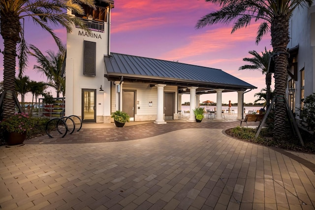 view of patio terrace at dusk